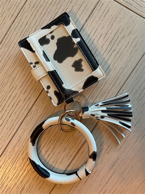 Get spotted with our chic Cow Print Keychain Wallet